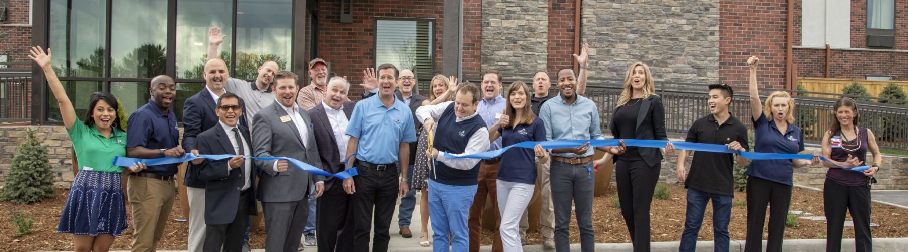 Ribbon Cutting At Uptown Suites